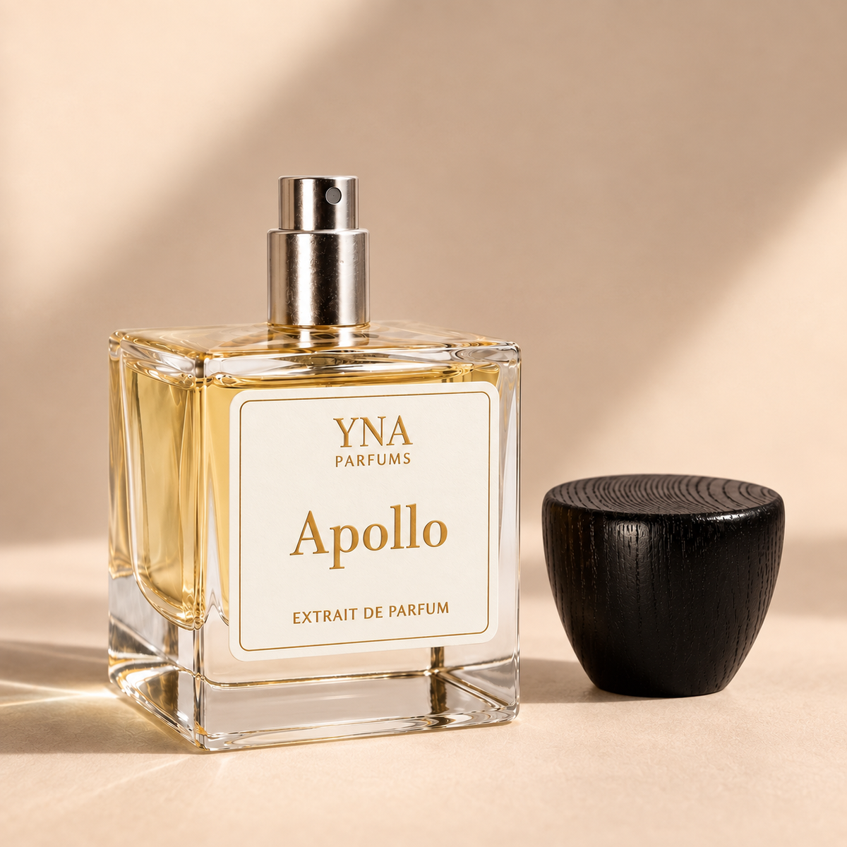 YNA Parfums Apollo Extrait de Parfum 50ml with dark wood cap removed and placed beside the bottle