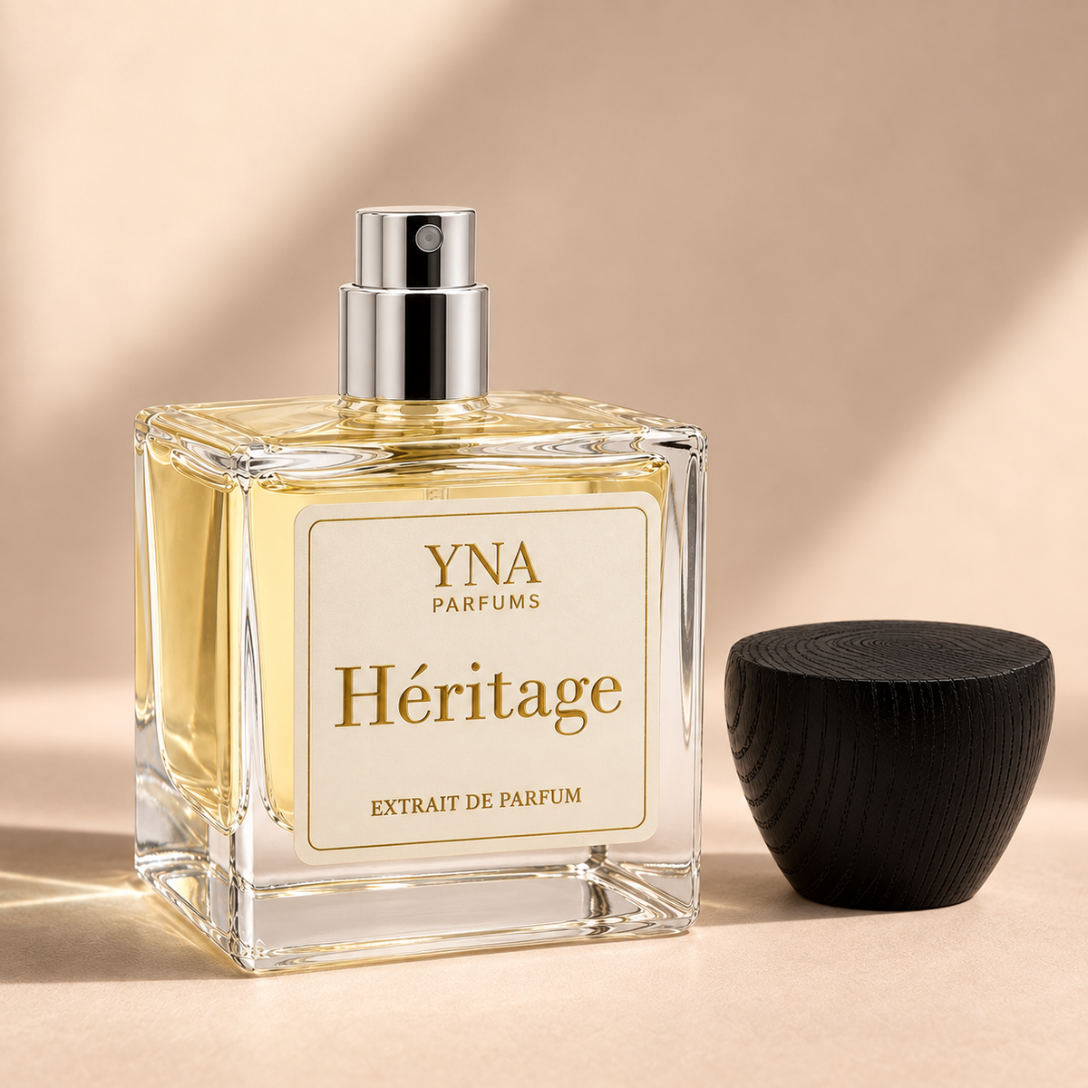 YNA Parfums Héritage Extrait de Parfum 50ml with dark wood cap removed and placed beside the bottle