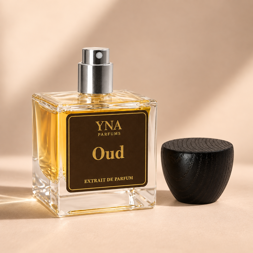 YNA Parfums Oud Extrait de Parfum 50ml with dark wood cap removed and placed beside the bottle