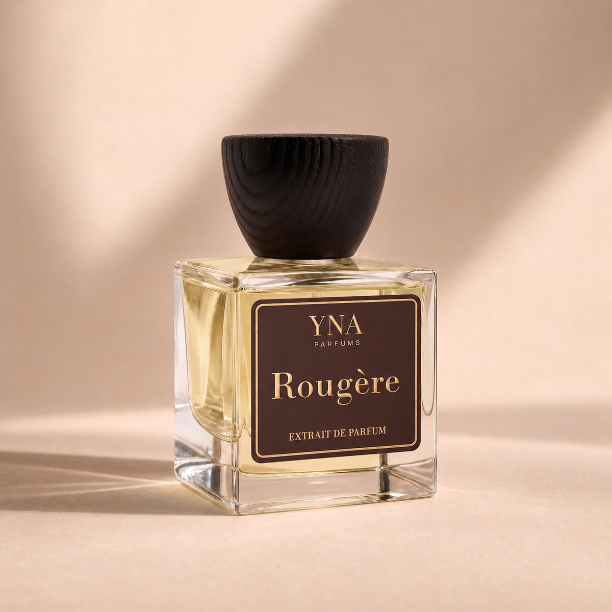 YNA Parfums Rougère Extrait de Parfum 50ml with dark wood cap on beige background